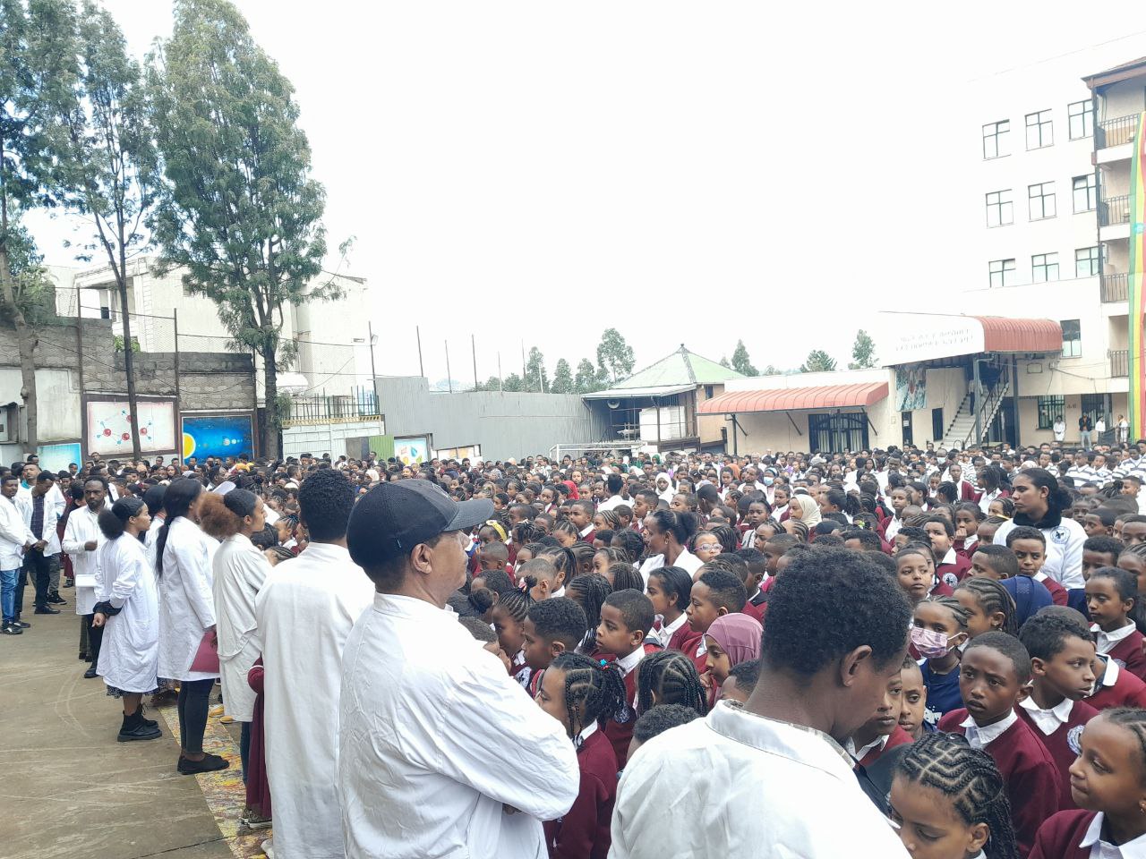 A diverse group of happy students at Bashewam School